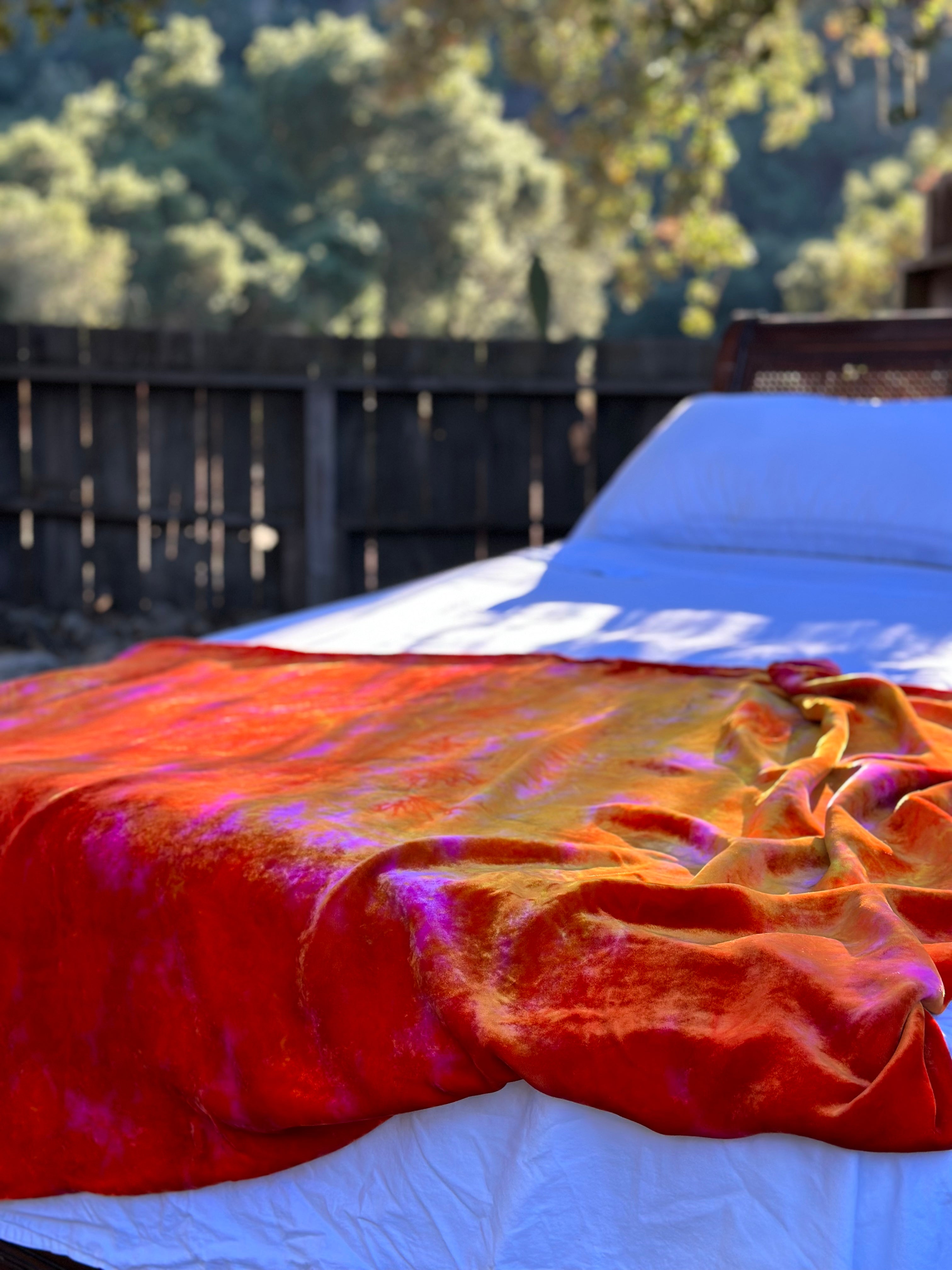 Luxury silk velvet blanket in mulitcolor tones of red carmine orange fuschia and yellow