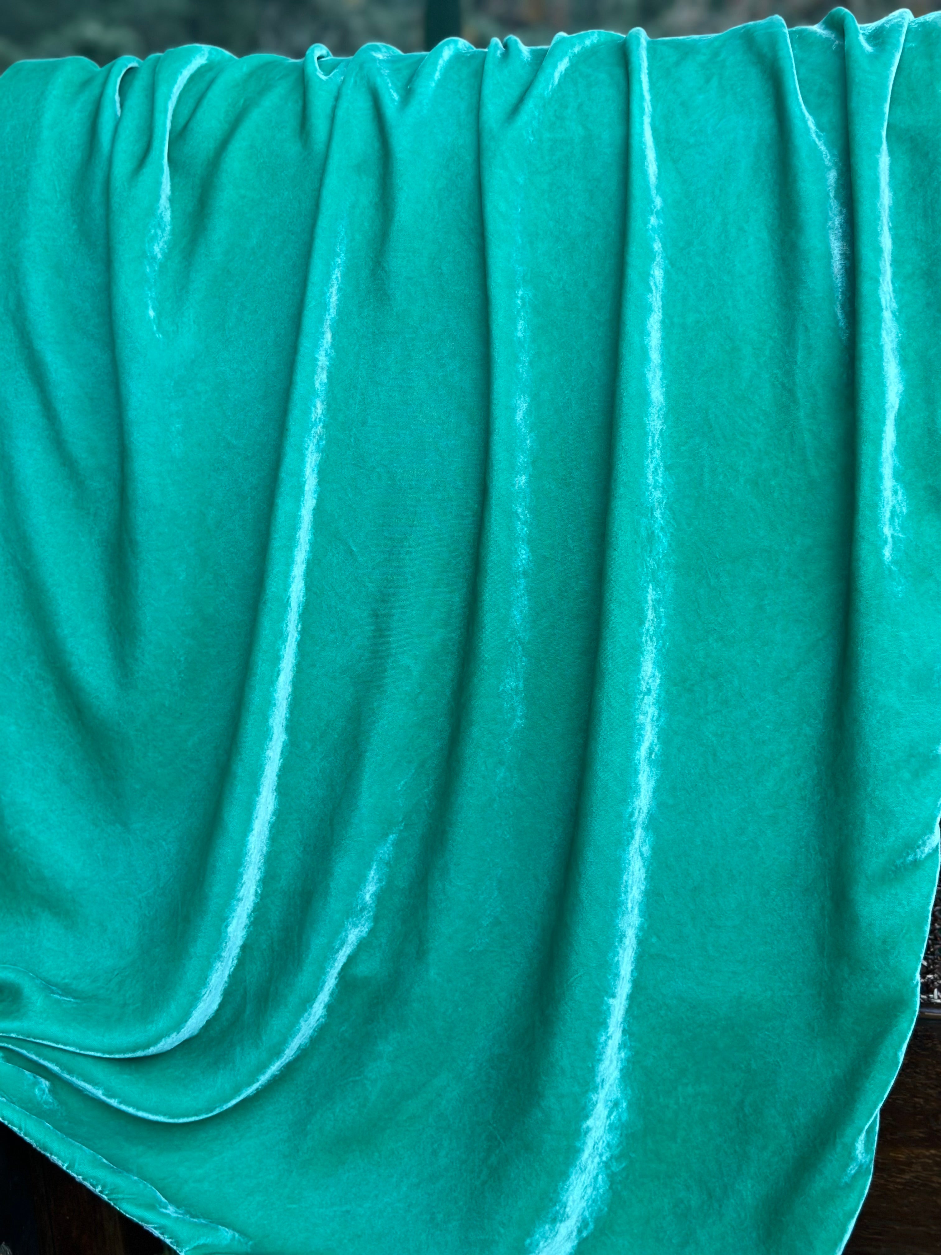 Luxury silk velvet blanket in teal green